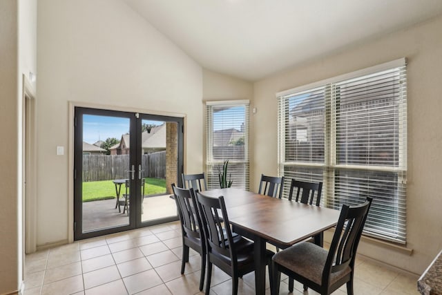 1336 Castlegar Ln, Fort Worth, TX 76247 - dining room with french doors, light tile patterned floors, and high vaulted ceiling