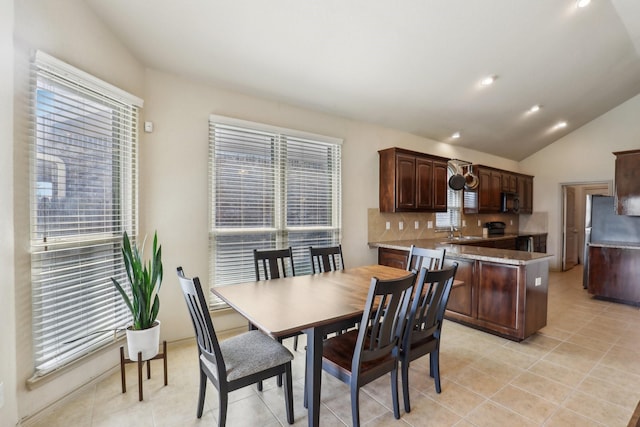 1336 Castlegar Ln, Fort Worth, TX 76247 - dining space with plenty of natural light, light tile patterned floors, lofted ceiling, and recessed lighting