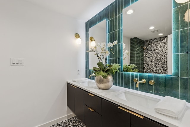 4216 Rickover Dr, Dallas, TX 75244 - full bath with double vanity, recessed lighting, tiled shower, and baseboards