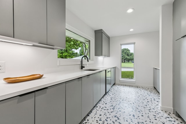 4216 Rickover Dr, Dallas, TX 75244 - kitchen with a sink, gray cabinets, stainless steel dishwasher, light countertops, and recessed lighting