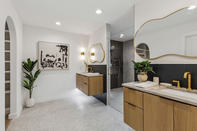 4216 Rickover Dr, Dallas, TX 75244 - full bath featuring two vanities, a walk in shower, recessed lighting, and baseboards