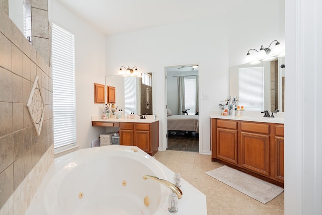 1005 Ruidoso Downs Dr, Talty, TX 75160 - bathroom featuring a jetted tub, healthy amount of natural light, vanity, and ensuite bathroom