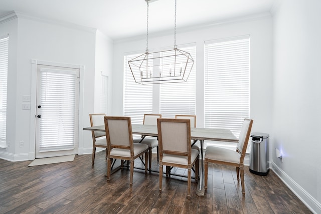 1005 Ruidoso Downs Dr, Talty, TX 75160 - dining room with a chandelier, dark wood-type flooring, and ornamental molding