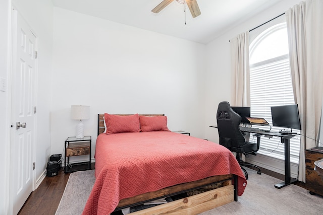 1005 Ruidoso Downs Dr, Talty, TX 75160 - bedroom with wood finished floors, a desk, and ceiling fan