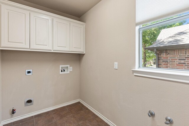 1908 Canyon Wren Dr, Mckinney, TX 75071 - washroom with hookup for a gas dryer, baseboards, cabinet space, electric dryer hookup, and hookup for a washing machine