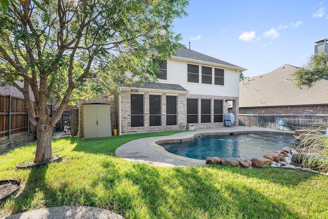 1908 Canyon Wren Dr, Mckinney, TX 75071 - rear view of property featuring brick siding, a storage unit, and a sunroom