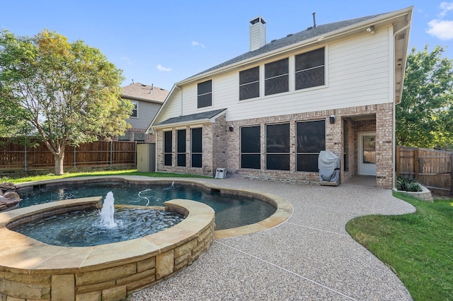1908 Canyon Wren Dr, Mckinney, TX 75071 - view of pool featuring a fenced backyard, a pool with connected hot tub, and a patio