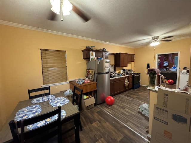 1206 Walnut St, Greenville, TX 75401 - dining area with a ceiling fan, ornamental molding, a textured ceiling, and dark wood-style floors