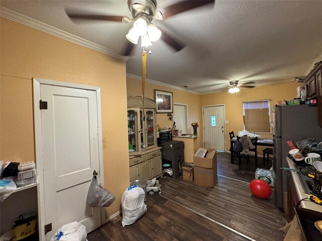 1206 Walnut St, Greenville, TX 75401 - office space featuring ceiling fan, crown molding, dark wood-style floors, and a textured ceiling