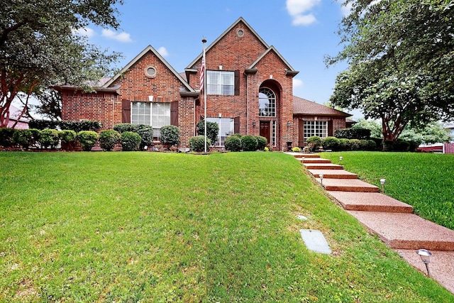 4700 Scoter Ln, Mckinney, TX 75072 - traditional-style home with a front yard and brick siding