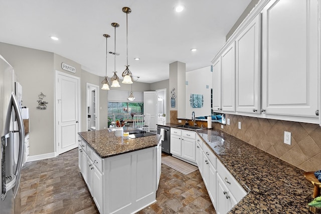 4700 Scoter Ln, Mckinney, TX 75072 - kitchen with stainless steel appliances, stone finish flooring, tasteful backsplash, white cabinetry, and recessed lighting