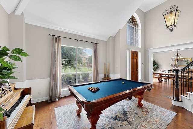 4700 Scoter Ln, Mckinney, TX 75072 - playroom with a chandelier, billiards, wood-type flooring, ornamental molding, and a towering ceiling