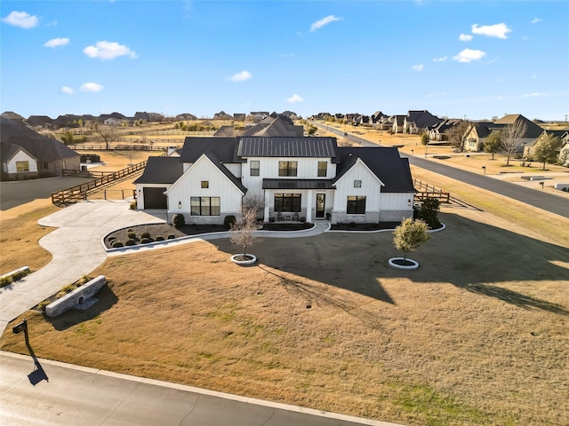 200 Sutherland Cres, Northlake, TX 76247 - view of front of home featuring board and batten siding, curved driveway, a residential view, and a garage
