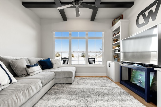 200 Sutherland Cres, Northlake, TX 76247 - living room featuring beam ceiling, light wood-style floors, a ceiling fan, and baseboards