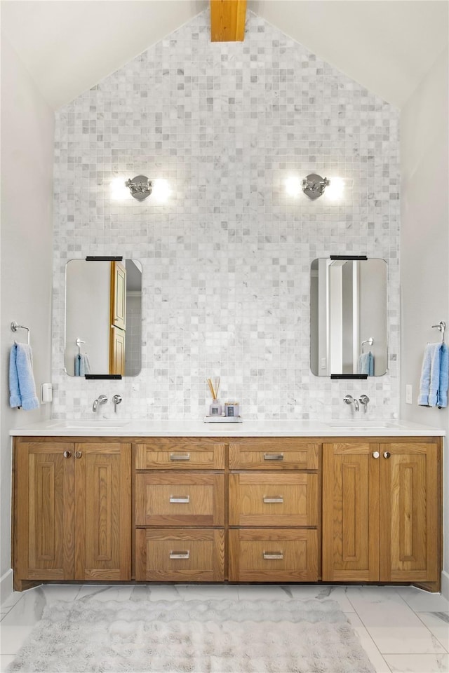 200 Sutherland Cres, Northlake, TX 76247 - full bathroom with lofted ceiling, marble look tile flooring, double vanity, and backsplash