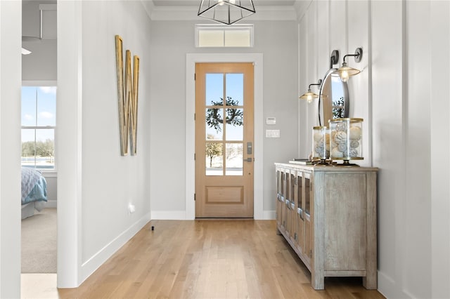 200 Sutherland Cres, Northlake, TX 76247 - entrance foyer featuring light wood-style flooring, a chandelier, baseboards, and crown molding
