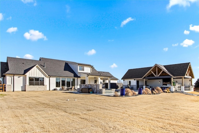 200 Sutherland Cres, Northlake, TX 76247 - rear view of house featuring board and batten siding, a patio area, and a shingled roof