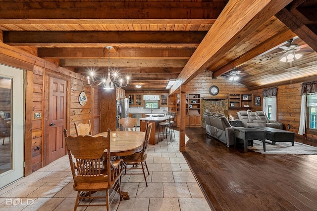 250 Mayo Rd, Shreveport, LA 71106 - dining space with plenty of natural light, wooden ceiling with exposed beams, stone tile floors, ceiling fan, and a chandelier