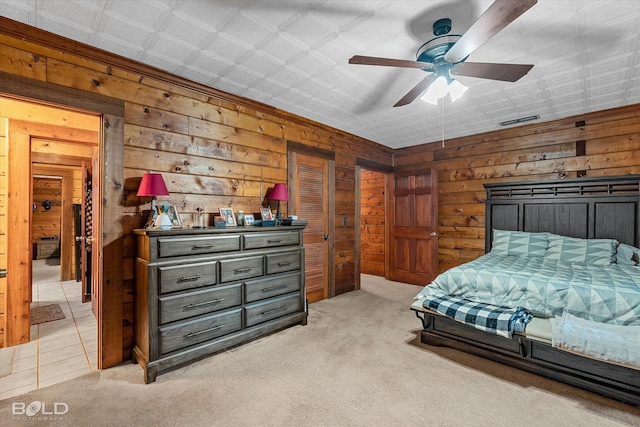 250 Mayo Rd, Shreveport, LA 71106 - bedroom featuring wooden walls, light colored carpet, and a ceiling fan