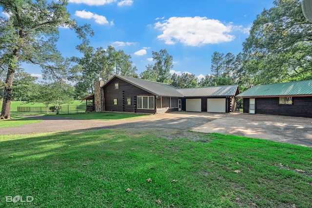 250 Mayo Rd, Shreveport, LA 71106 - log-style house featuring concrete driveway, a chimney, metal roof, and a garage