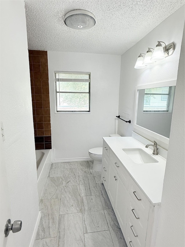 1136 Simpson Dr, Hurst, TX 76053 - full bath featuring healthy amount of natural light, vanity, marble finish floors, and a textured ceiling