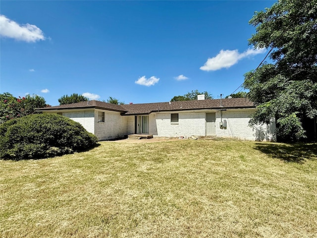 1136 Simpson Dr, Hurst, TX 76053 - rear view of house featuring a lawn and brick siding