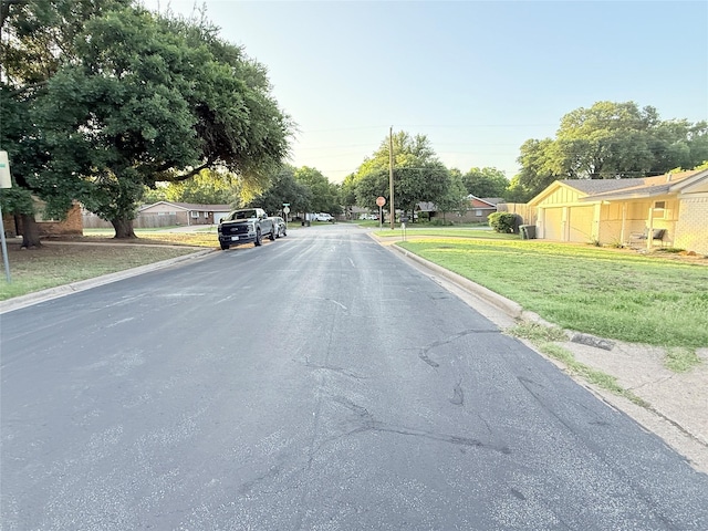 1136 Simpson Dr, Hurst, TX 76053 - view of asphalt street with curbs and traffic signs
