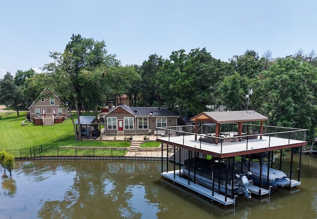 102 Anderson Ln, Mabank, TX 75156 - dock featuring boat lift, a deck with water view, and view of wooded area