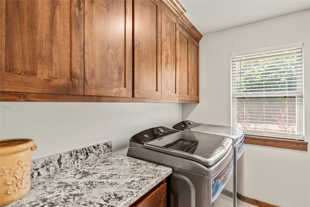 102 Anderson Ln, Mabank, TX 75156 - laundry room with cabinet space, washer and dryer, and baseboards