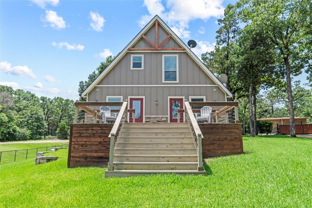 102 Anderson Ln, Mabank, TX 75156 - back of property featuring stairs, a deck, and board and batten siding