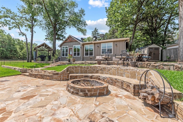 102 Anderson Ln, Mabank, TX 75156 - back of house with a gazebo, a fire pit, board and batten siding, and a patio