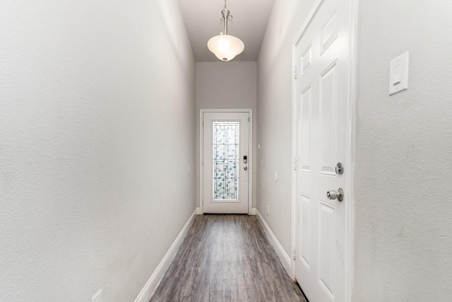 3760 Soft Wind Dr, Dallas, TX 75241 - entryway with dark wood-type flooring and baseboards