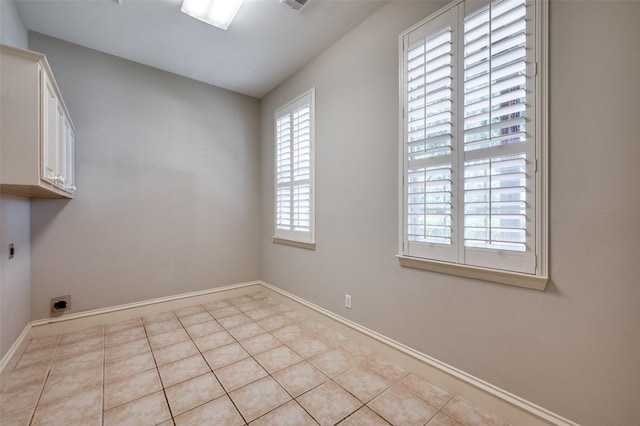 2673 April Sound Ln, Frisco, TX 75033 - washroom with cabinet space, hookup for an electric dryer, baseboards, and tile patterned floors