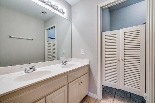 2673 April Sound Ln, Frisco, TX 75033 - bathroom featuring double vanity and tile patterned flooring