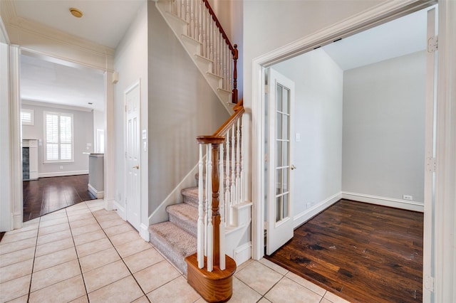 2673 April Sound Ln, Frisco, TX 75033 - staircase with tile patterned floors and baseboards