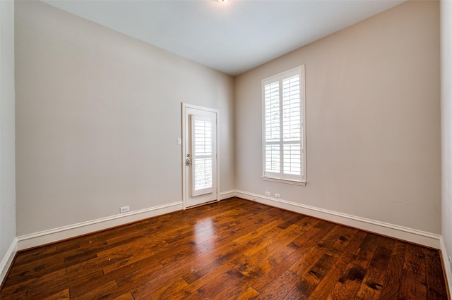 2673 April Sound Ln, Frisco, TX 75033 - empty room with baseboards and dark wood-style flooring