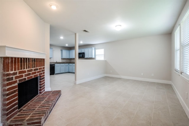 10556 Midway Dr, Frisco, TX 75035 - unfurnished living room with a brick fireplace, baseboards, and recessed lighting