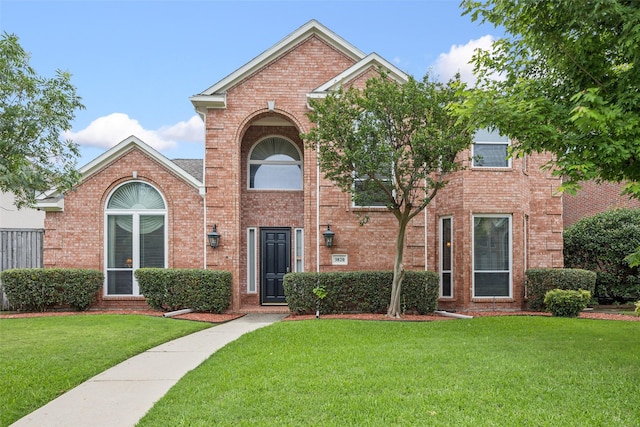 3820 Nash Ln, Plano, TX 75025 - traditional-style home with brick siding and a front yard
