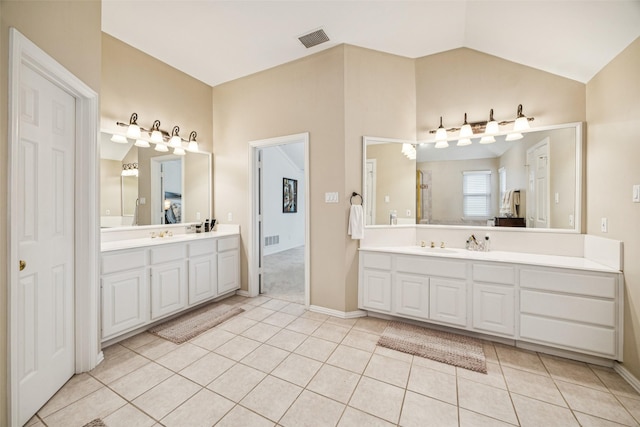 3820 Nash Ln, Plano, TX 75025 - bathroom featuring vanity, tile patterned flooring, lofted ceiling, and baseboards