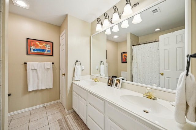 3820 Nash Ln, Plano, TX 75025 - bathroom with tile patterned flooring, double vanity, toilet, and baseboards