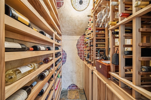 3820 Nash Ln, Plano, TX 75025 - wine room featuring dark stone finish flooring