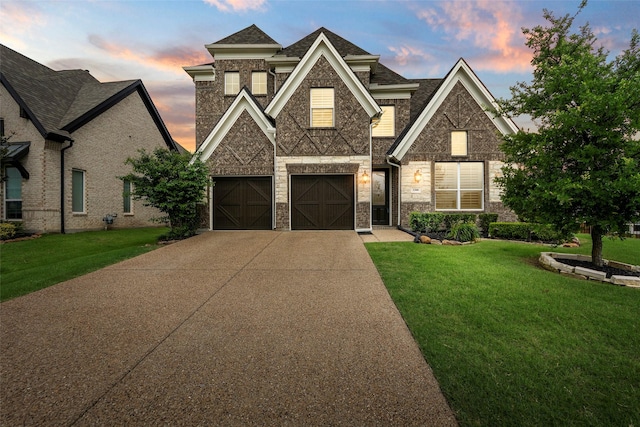 3300 Calvin Rd, Mckinney, TX 75071 - view of front of house with driveway, an attached garage, a lawn, and stone siding