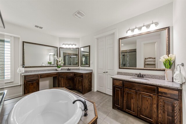 3300 Calvin Rd, Mckinney, TX 75071 - bathroom with two vanities, a bath, tile patterned flooring, and a shower with door