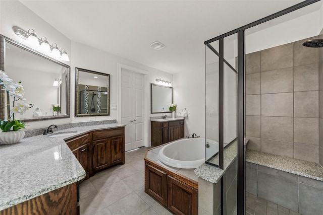 3300 Calvin Rd, Mckinney, TX 75071 - full bathroom featuring a stall shower, a bath, tile patterned floors, and two vanities