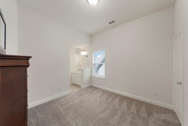 3300 Calvin Rd, Mckinney, TX 75071 - unfurnished bedroom featuring light colored carpet, baseboards, ensuite bathroom, and a sink