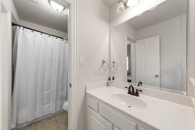 3300 Calvin Rd, Mckinney, TX 75071 - bathroom with toilet, vanity, tile patterned floors, and a shower with shower curtain