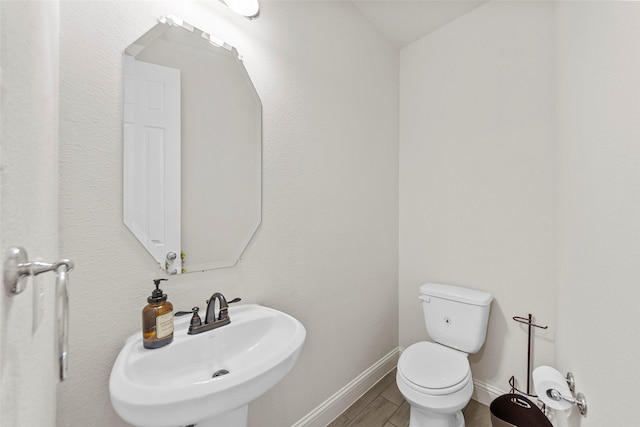 3300 Calvin Rd, Mckinney, TX 75071 - half bath featuring a sink, toilet, and baseboards