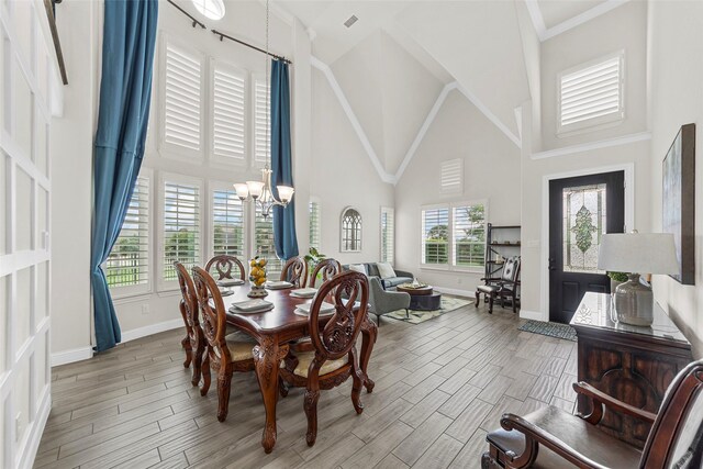 3300 Calvin Rd, Mckinney, TX 75071 - dining area featuring high vaulted ceiling, a chandelier, baseboards, and plenty of natural light