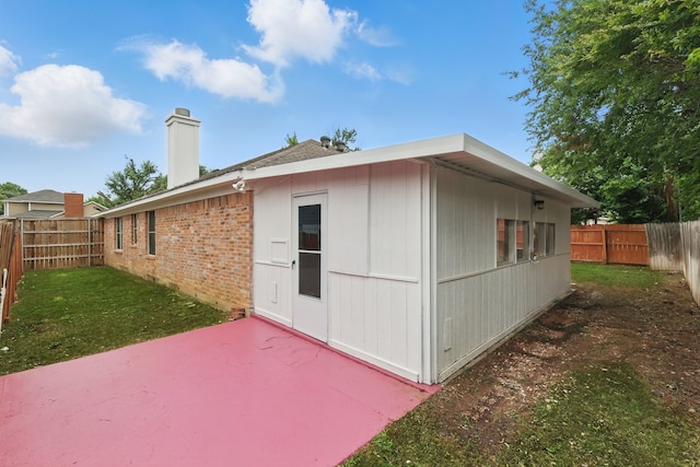 3220 Steamboat Dr, Fort Worth, TX 76123 - rear view of property with a chimney, a patio, and brick siding