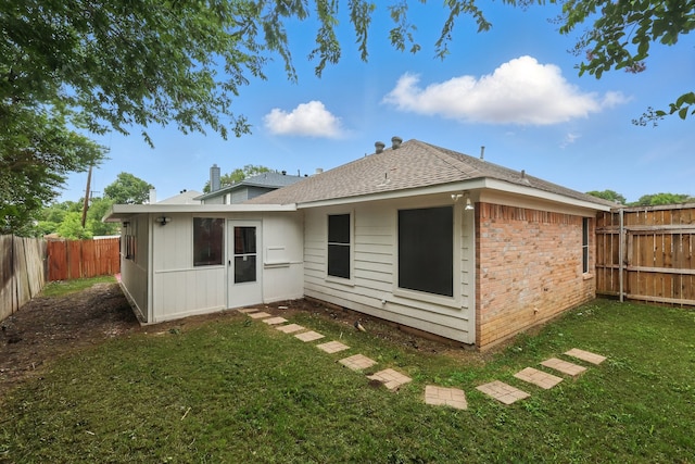 3220 Steamboat Dr, Fort Worth, TX 76123 - rear view of property featuring brick siding and roof with shingles